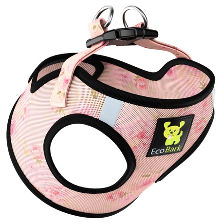 EcoBark Floral dog harness featuring a pink rose pattern with black trim, reflective shoulder strips, and padded breathable mesh on a white background.