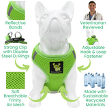 Infographic detailing the features of the lime green EcoBark step-in dog harness on a white dog model. Features include reflective bands, a strong clip with double steel D-rings, soft breathable Trinity air mesh, an adjustable hook and loop fastener, and it is made with sustainable recycled materials and reviewed by veterinarians.