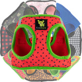EcoBark Watermelon Dog Harness nestled on top of a camo dog harness, floral dog harness, houndstooth dog harness, tie-dye dog harness, cheetah dog harness, and buffalo check dog harness.